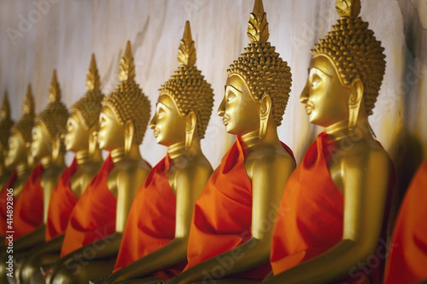 Fototapeta Buddha statue in Wat Arun at Bangkok, Thailand. Row of famous ancient buddha statue at Wat Arun.