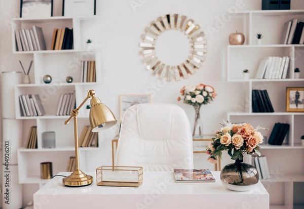 Fototapeta female office with a workspace desk in a light modern style with white furniture with laptop on table