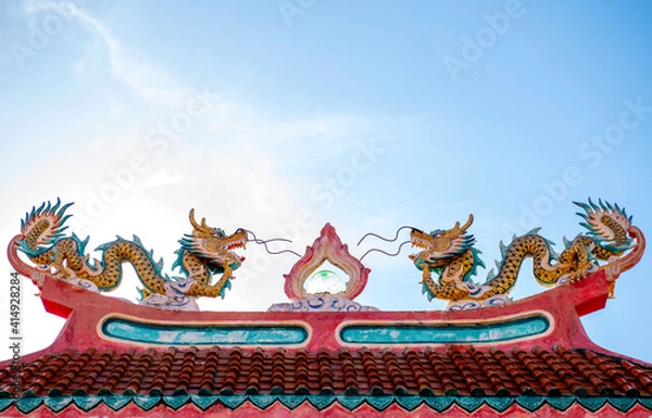 Fototapeta Old dragon statues, popularly installed at the gates of Chinese temples or shrines