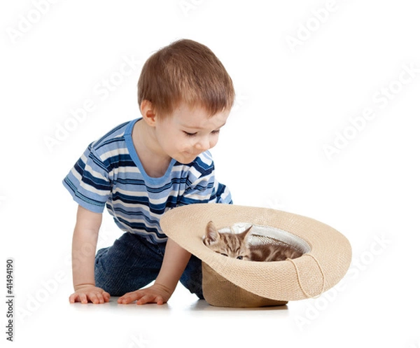 Fototapeta kid playing with cat in hat