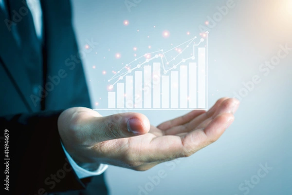 Fototapeta Business people are using Stock chart innovative technology. Mixed media, digital smartphone and online shopping concept.