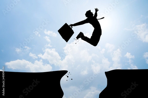 Fototapeta bussiness man jumping over the mountains