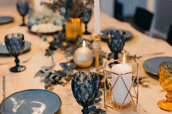 Obraz Table setting in blue and gold colors.