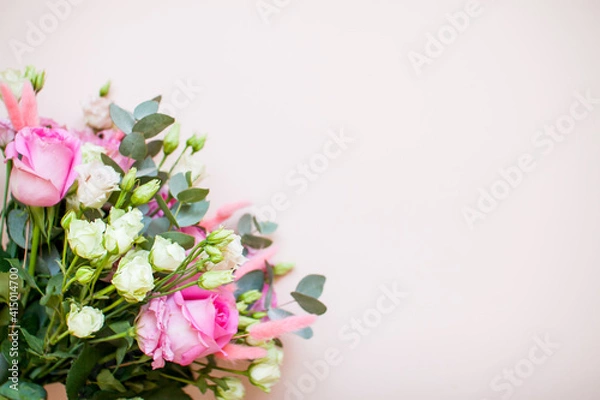 Fototapeta Delicate touching bouquet of white and pink flowers on a light pink background. Layout. Flat lay