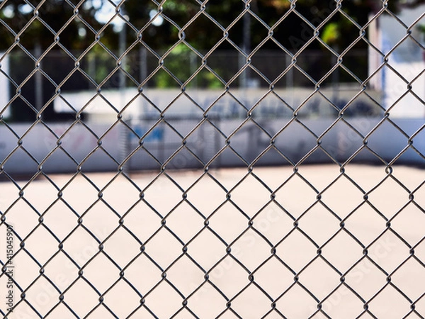 Fototapeta chain link fence with barbed wire