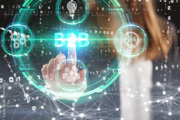 Fototapeta Business, Technology, Internet and network concept. Young businessman working on a virtual screen of the future and sees the inscription: B2B