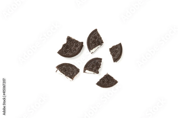Fototapeta Biscuits chocolate  with crumbs on white background. It is a chocolate cookies with a sweet cream.