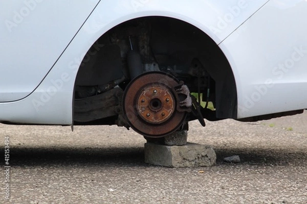 Obraz Missing wheel on car