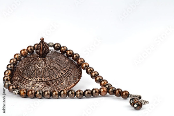 Fototapeta Ramadan concept with prayer beads and plate