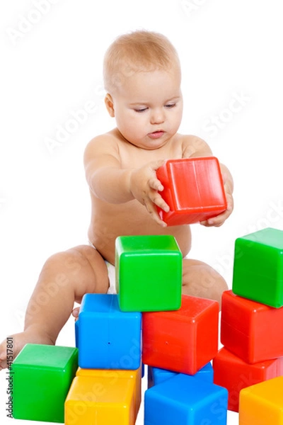 Fototapeta Little baby playing with cubes