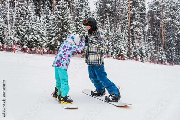 Fototapeta Learning to snowboard