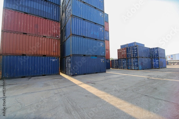 Obraz Foreman control loading Containers box from Cargo freight ship for import export. Container Warehouse Worker