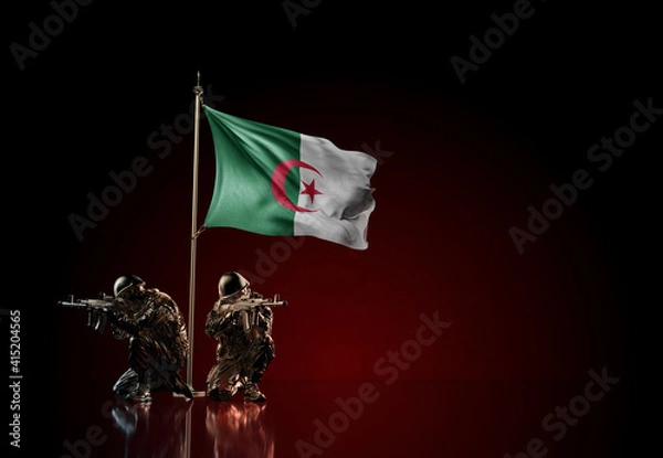 Obraz Concept of military conflict. Waving national flag of Algeria. Illustration of coup idea. Two soldier statue guards defending the symbol of country against red wall
