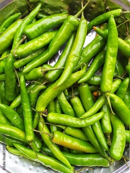 Obraz Top view of fresh green serrano pepper as a background