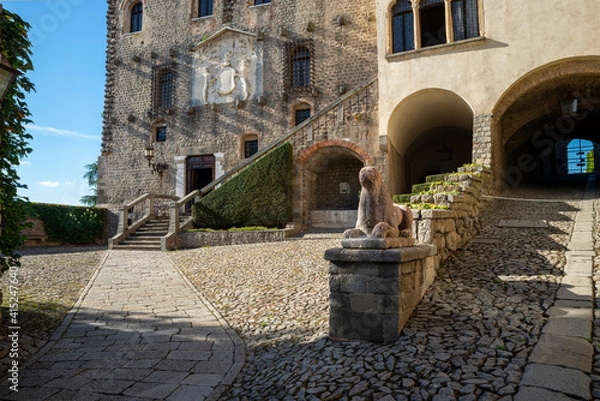 Fototapeta The castle of Monselice inside the complex of buildings composed of four main nuclei, plus a fortress, detail of the sphinx of the battlements and mullioned windows. Padua, Veneto, Italy.
