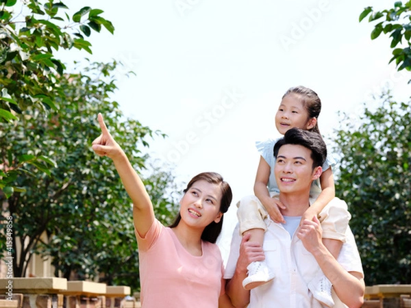 Obraz Happy family of three in the outdoor group photo