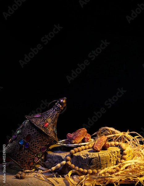 Fototapeta Ramadan concept with dried dates and lantern