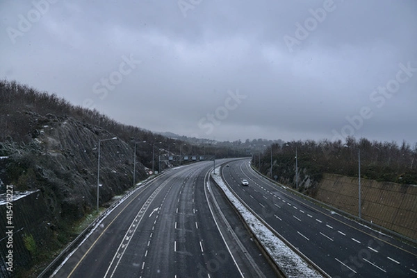 Fototapeta Beautiful view of empty motorway M50 Dublin, Ireland. Transportation during Level 5 restrictions in Dublin. Irish winter weather. Winter highway