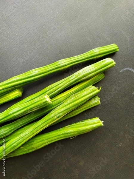 Obraz moringa oleifera isolated on black surface, closeup