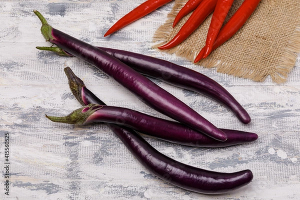 Fototapeta Purple chinese  eggplants and red chili peppers