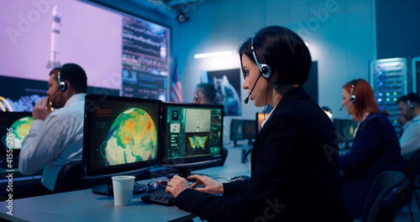 Fototapeta Flight operator using computer during spacecraft launch