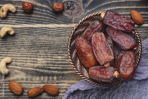 Fototapeta Ramadan concept with dried of dates. Top view