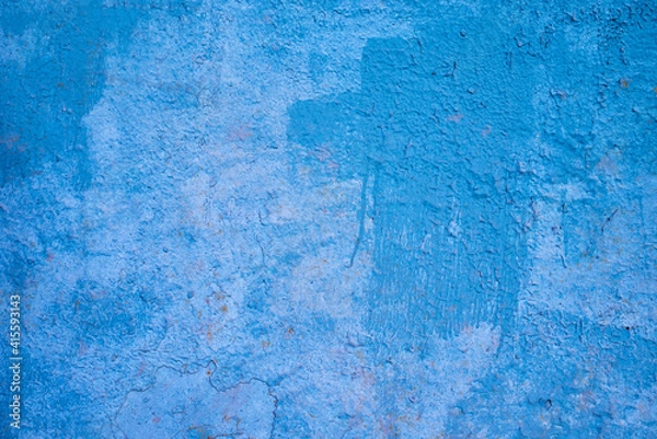 Fototapeta the texture of an old blue painted wall. rough background.