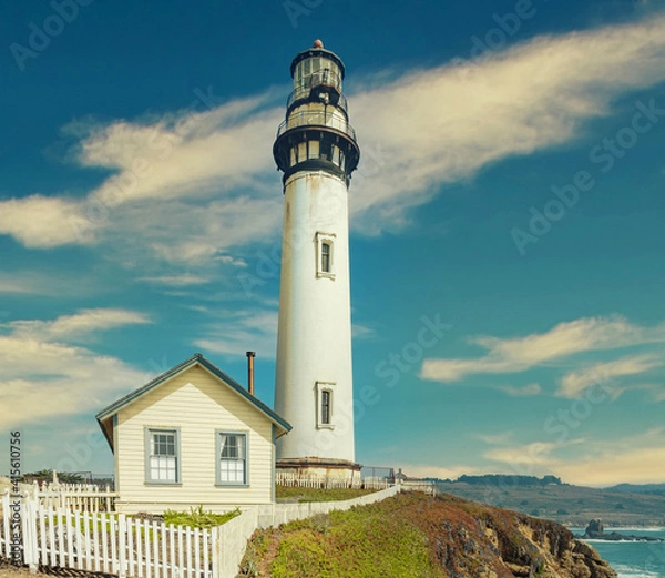 Fototapeta Pigeon Point lighthouse against the backdrop of a beautiful sky and ocean with waves, a great landscape of the Pacific coast in California