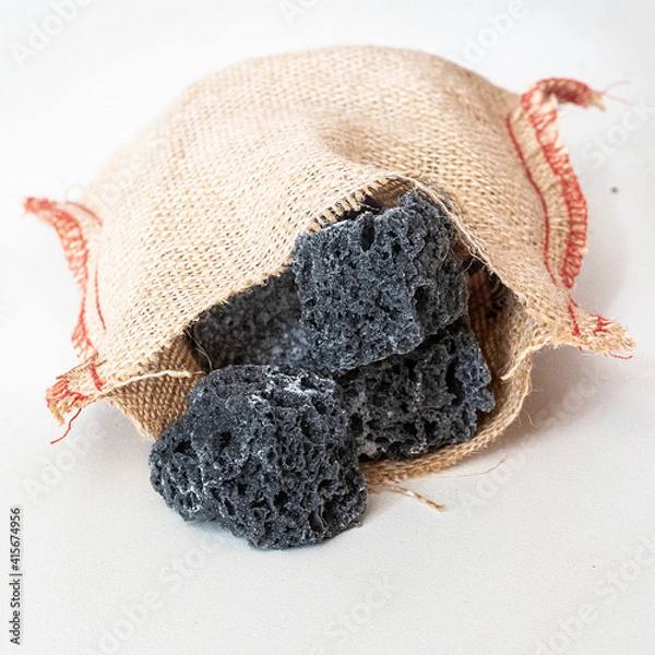 Fototapeta Chunks of sweet coal inside a burlap sack