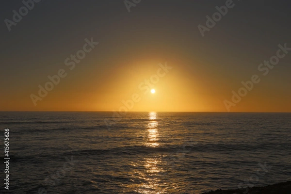 Fototapeta A beautiful sunset over the ocean at Sunset Cliffs in California. Magic hour sky.