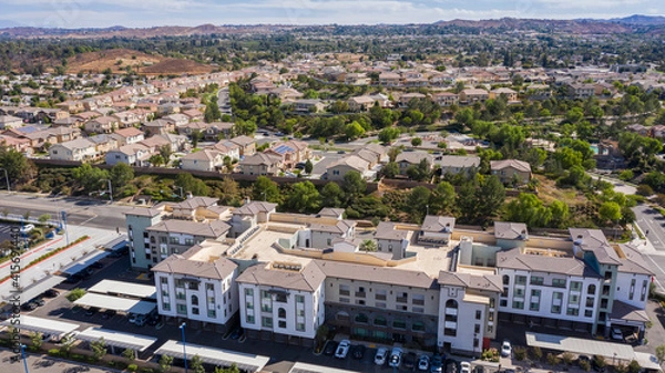 Fototapeta Daytime aerial view of a high density suburban neighborhood in Riverside, California, USA.