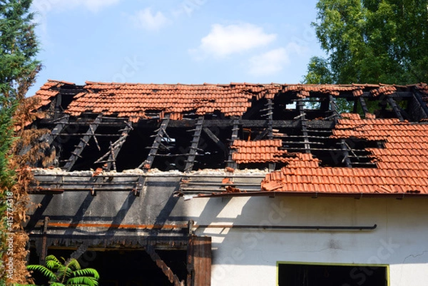 Obraz Roof and house destroyed by a fire