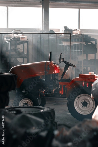 Obraz Red tractor at farm

