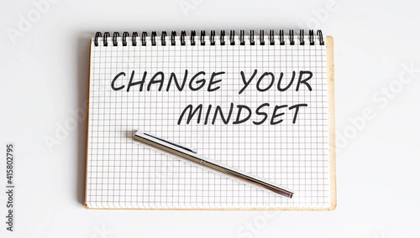 Fototapeta Notebook with pen , text Change Your Mindset ,concept