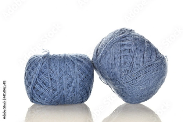 Fototapeta Two spools of blue thread, close-up, isolated on white.