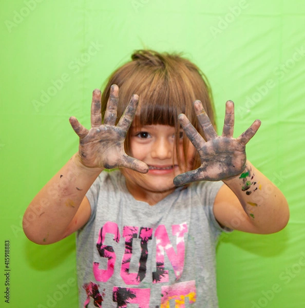 Obraz Creative Girl with Paint on her Hands makes a Mess. Green Screen