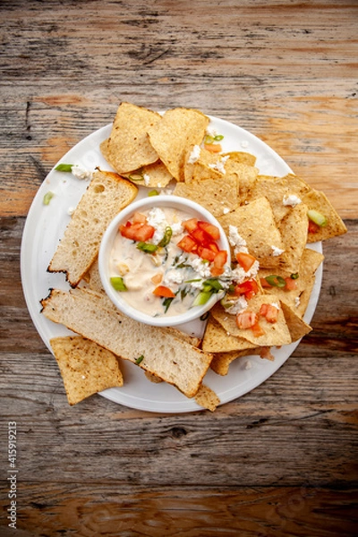 Obraz Yummy Quesadilla Dip with Bread and Chips and fresh Herbs and Tomatoes