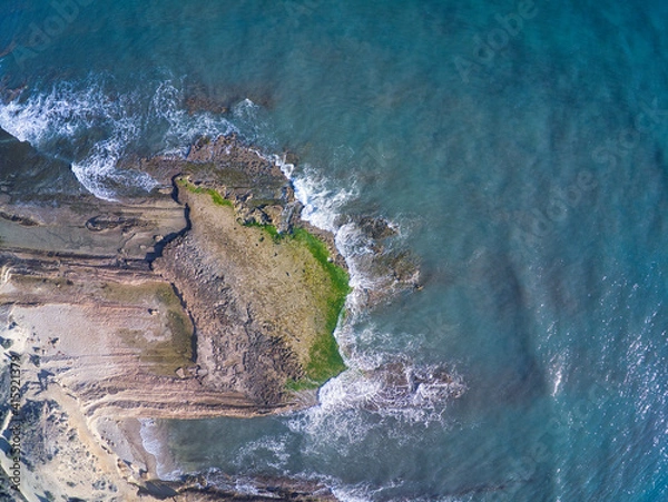 Fototapeta Aerial drone view of the rocks of Cabo Huertas beach in Alicante, located in the Valencian Community, Spain