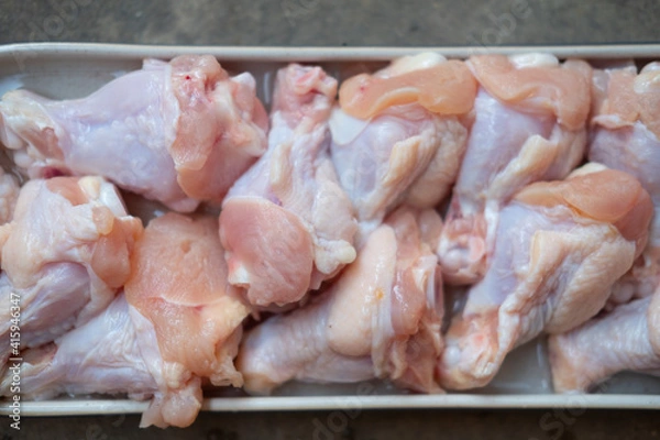 Fototapeta Raw chicken drumsticks for is various cooking as boiled, grill and fried