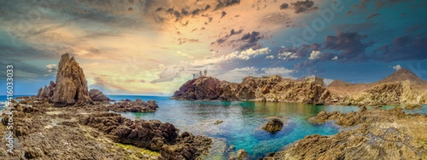 Fototapeta Panoramic view from the Arrecife de las Sirenas in Cabo de Gata, Spain. Sunset in Seascape with reefs and clouds