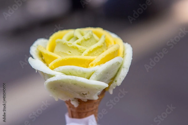 Fototapeta Ice cream in the shape of a rose flower with different flavors.