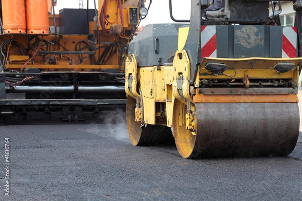 Obraz Roadwork road roller and paving machine at asphalt