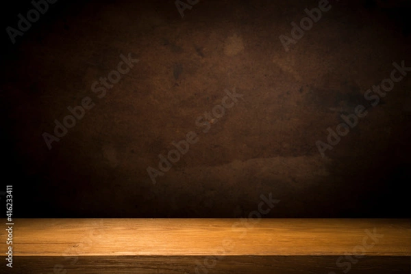 Fototapeta Selected focus empty brown wooden table and wall texture or old black brick wall blur background image. for your photomontage or product display