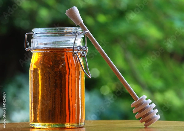 Obraz Jar of Honey with stir stick