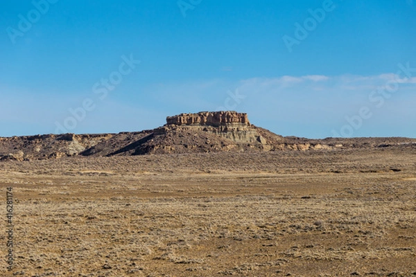 Fototapeta Rock plateau in the middle of high desert in rural New Mexico on clear day