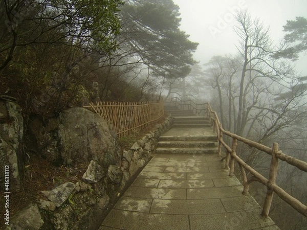 Fototapeta China Mount HuangShan - April, 2015: Natural scenery, sunsets, peculiarly-shaped granite peaks, Huangshan pine trees and views of the clouds from above. Photo taken in Yellow Mountain (UNESCO).