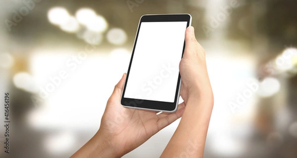 Fototapeta Hands holding a tablet touch computer gadget