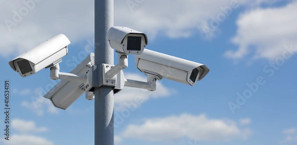 Obraz Four CCTV security cameras on a pole