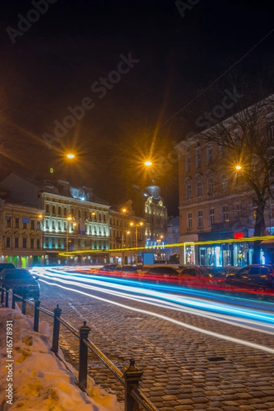 Fototapeta Night Lviv old city architecture in the winter season. Buildings highlighted by the illumination
