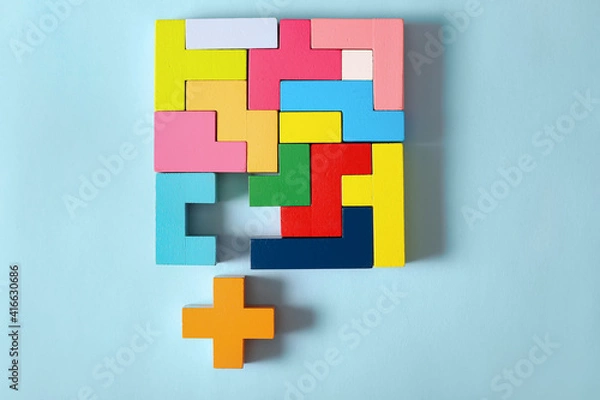Fototapeta Multicolored puzzle, cubes on a blue background